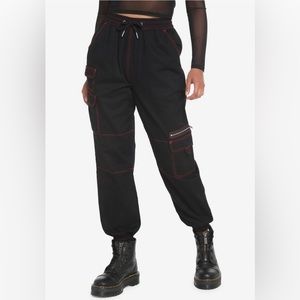Black Cargo pants with red stitching, made by Hot Topic.